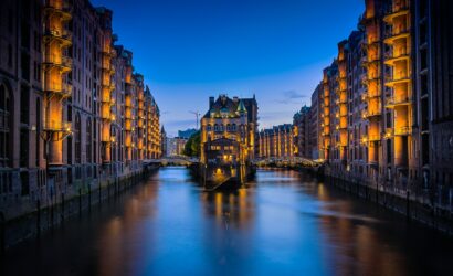 canal between buildings during nighttime