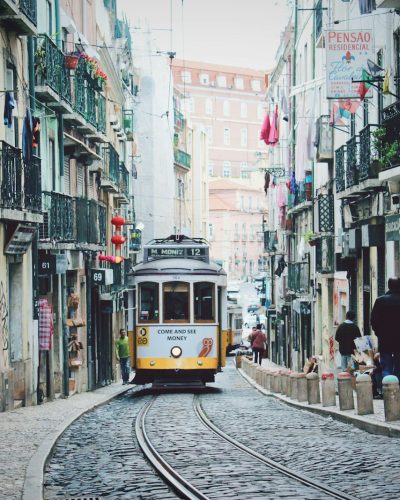 train passing in between buildings