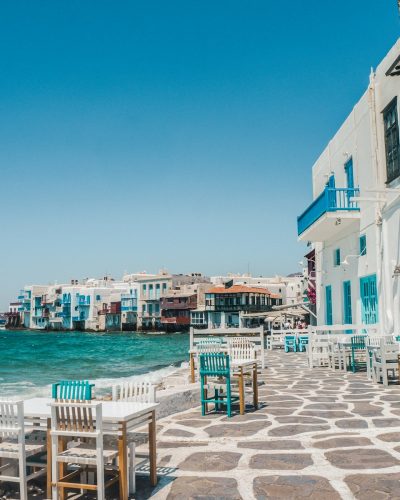 white and brown concrete buildings near sea during daytime